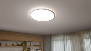 As lâmpadas de incandescência LED de inspiração vintage como candeeiros suspensos criam um ambiente acolhedor numa sala de jantar aconchegante, apresentando soluções de iluminação da Habitação elegantes e Enérgeticamente eficientes